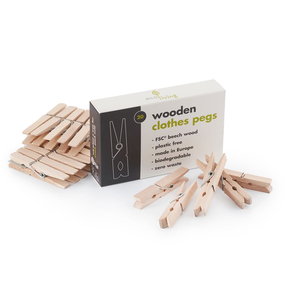 Wooden clothes pegs with packaging on a white background